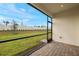 Screened patio overlooking grassy backyard at 12355 Hearts Ease St, Venice, FL 34293