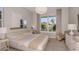 Bright bedroom with a large bed and neutral color scheme at 13813 Sharp Hawk Dr, Riverview, FL 33569