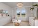Bright Bedroom featuring a crib, changing table, and ample natural light at 13813 Sharp Hawk Dr, Riverview, FL 33569