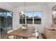 Bright dining room with a wooden table and access to the pool area at 13813 Sharp Hawk Dr, Riverview, FL 33569