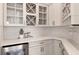 Butlers pantry with wine storage and quartz countertops at 13813 Sharp Hawk Dr, Riverview, FL 33569