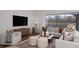 Relaxing living room with two sofas and a view to the backyard at 13813 Sharp Hawk Dr, Riverview, FL 33569