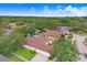 House with a large backyard and a two-car garage at 2813 Norwood Hills Ln, Valrico, FL 33596