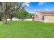 Spacious backyard offering a grassy area at 2813 Norwood Hills Ln, Valrico, FL 33596