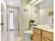 Bathroom with single vanity and access to backyard at 2813 Norwood Hills Ln, Valrico, FL 33596