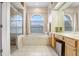 Elegant bathroom with a large soaking tub, double vanity, and a walk-in shower at 2813 Norwood Hills Ln, Valrico, FL 33596