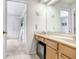 Clean bathroom with double vanity and mini-fridge at 2813 Norwood Hills Ln, Valrico, FL 33596