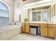 Elegant bathroom with double vanity, garden tub, and separate shower at 2813 Norwood Hills Ln, Valrico, FL 33596