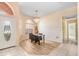Charming dining area with wood flooring and a view of the entryway at 2813 Norwood Hills Ln, Valrico, FL 33596