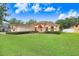 Single-story house with a large front yard and mature trees at 2813 Norwood Hills Ln, Valrico, FL 33596