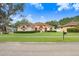 Attractive home with a well-maintained lawn and a long driveway at 2813 Norwood Hills Ln, Valrico, FL 33596