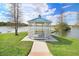 Quaint gazebo overlooking a peaceful lake at 2813 Norwood Hills Ln, Valrico, FL 33596
