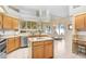 Open concept kitchen with island, ample counter space, and a breakfast nook at 2813 Norwood Hills Ln, Valrico, FL 33596