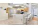 Modern kitchen with light wood cabinets, granite countertops, and stainless steel appliances at 2813 Norwood Hills Ln, Valrico, FL 33596