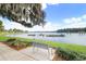 Peaceful lake view with a bench for relaxation at 2813 Norwood Hills Ln, Valrico, FL 33596