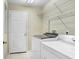 Laundry room with washer, dryer, and shelving at 2813 Norwood Hills Ln, Valrico, FL 33596