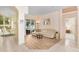 Open living room with hardwood flooring, neutral tones, and access to the backyard at 2813 Norwood Hills Ln, Valrico, FL 33596