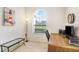 Home office with desk, chair, and large window at 2813 Norwood Hills Ln, Valrico, FL 33596