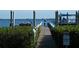 Private dock with pathway and a stop sign leading to the water at 413 S Bayshore Blvd # B1, Safety Harbor, FL 34695