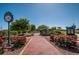 Brick pathway through a park with landscaping and clock at 413 S Bayshore Blvd # B1, Safety Harbor, FL 34695