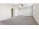 Well-lit bedroom featuring ceiling fan and carpet flooring at 526 19Th Nw St, Ruskin, FL 33570