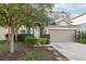 Two-story house with attached garage and manicured lawn at 526 19Th Nw St, Ruskin, FL 33570