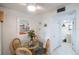 Cozy dining area with a glass-top table and wicker chairs at 600 71St Ave # 17, St Pete Beach, FL 33706