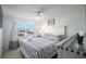 Spacious main bedroom with a king-size bed and white dresser at 600 71St Ave # 17, St Pete Beach, FL 33706