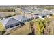 Aerial view of houses near a lake and conservation area at 10864 Banyan Breeze Blvd, Land O Lakes, FL 34638