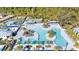 Aerial view of community pool, lounge areas, and tennis courts at 10864 Banyan Breeze Blvd, Land O Lakes, FL 34638