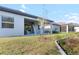 Landscaped backyard with covered patio and privacy at 10864 Banyan Breeze Blvd, Land O Lakes, FL 34638
