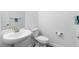 Clean bathroom with toilet, sink, and vanity at 10864 Banyan Breeze Blvd, Land O Lakes, FL 34638