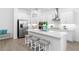 Modern kitchen featuring white cabinetry, stainless steel appliances, and a large island at 10864 Banyan Breeze Blvd, Land O Lakes, FL 34638