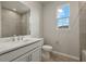 Clean bathroom featuring a vanity with white cabinets and a shower at 12310 Hearts Ease St, Venice, FL 34293