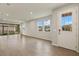 Bright and spacious living room with tile flooring and large windows at 12310 Hearts Ease St, Venice, FL 34293