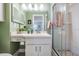 Clean bathroom with a walk-in shower and updated vanity at 1435 Millstream Ln # 202, Dunedin, FL 34698