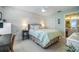 Charming bedroom with wood-paneled wall and en-suite bathroom at 1435 Millstream Ln # 202, Dunedin, FL 34698