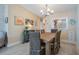 Bright dining room with wood table and chairs, beachy decor at 1435 Millstream Ln # 202, Dunedin, FL 34698