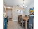 Dining room with wooden table and chairs, near kitchen at 1435 Millstream Ln # 202, Dunedin, FL 34698