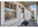 Private balcony with bench, door, and window at 1435 Millstream Ln # 202, Dunedin, FL 34698