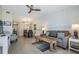 Open concept living and dining area with light flooring at 1435 Millstream Ln # 202, Dunedin, FL 34698