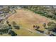 Large grassy area with walking path, ideal for recreation at 1435 Millstream Ln # 202, Dunedin, FL 34698