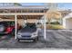 Covered carport parking for residents at 1435 Millstream Ln # 202, Dunedin, FL 34698