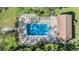 Community pool with plenty of lounge chairs for relaxing at 1435 Millstream Ln # 202, Dunedin, FL 34698