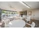 Community poolside pavilion with tables and chairs at 1435 Millstream Ln # 202, Dunedin, FL 34698