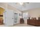 Bright bedroom featuring tiled floors and access to a patio at 1510 Mahogany Ln # 606, Palm Harbor, FL 34683