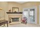Living room fireplace with tiled surround and mantle at 1510 Mahogany Ln # 606, Palm Harbor, FL 34683