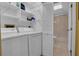 Laundry room with washer, dryer, shelving and access to a bathroom at 1510 Mahogany Ln # 606, Palm Harbor, FL 34683