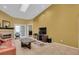 Living area with vaulted ceiling, fireplace and large TV at 1510 Mahogany Ln # 606, Palm Harbor, FL 34683