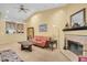 Living room with view into kitchen and fireplace at 1510 Mahogany Ln # 606, Palm Harbor, FL 34683